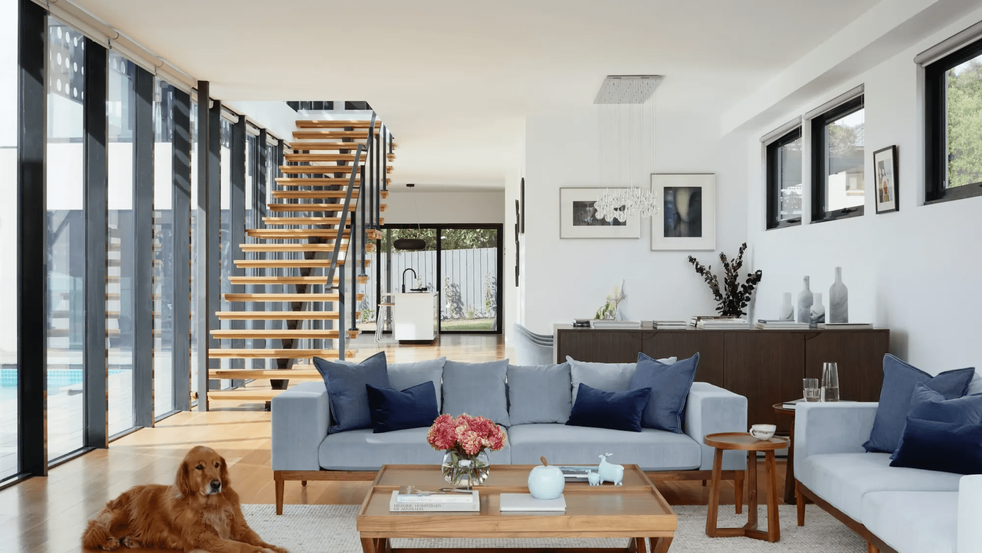 Spacious living area with wooden staircase